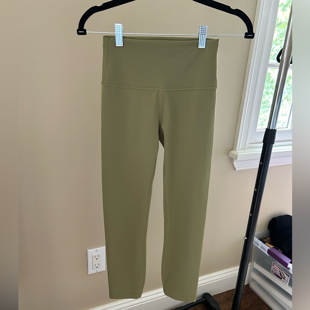 NWOT Lululemon Wunder Train High Rise Crop 23” leggings in bronze green size 4